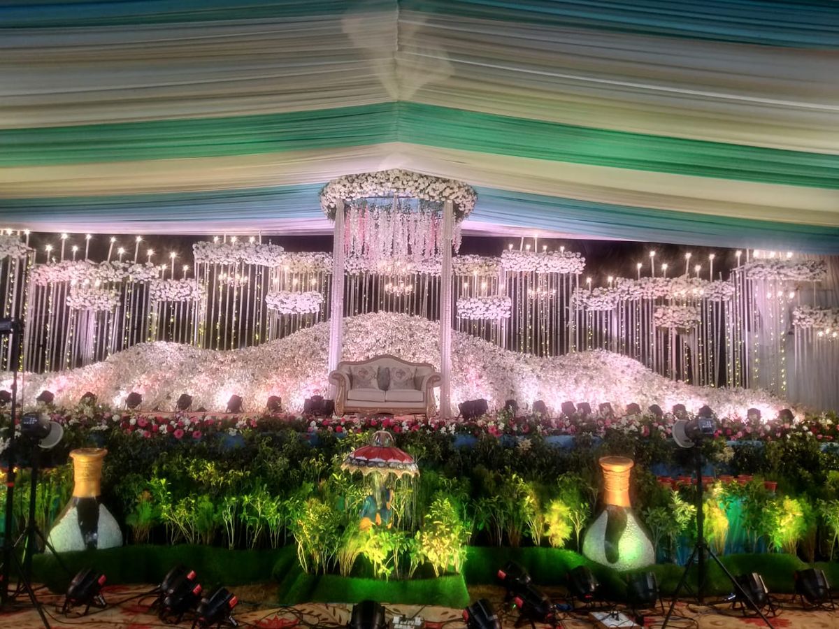 Destination wedding orange teal pandal