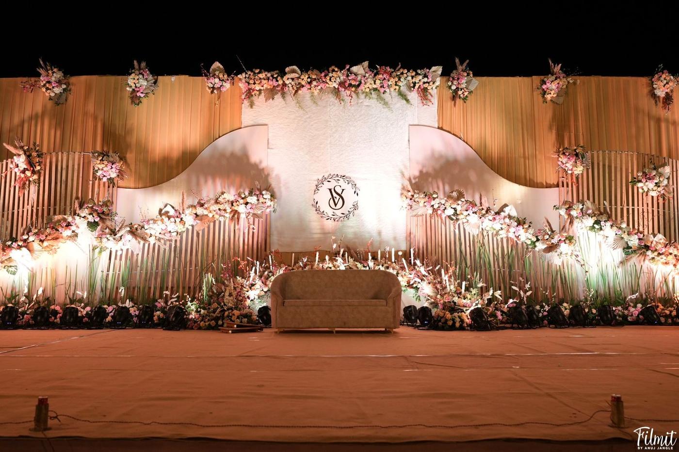 Bamboo floral stage warm toned wedding